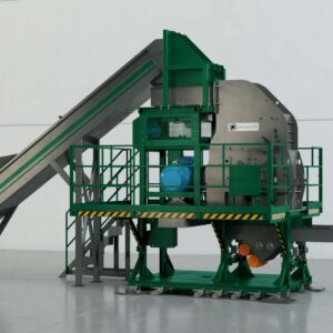 Industrial waste processing hammer mill with conveyor system in a factory setting.