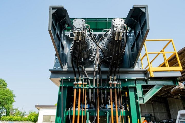 Industrial waste pre-shredder machine for recycling and waste management.
