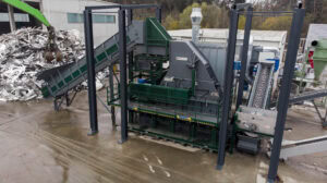 Industrial waste processing hammer mill for recycling and waste management.