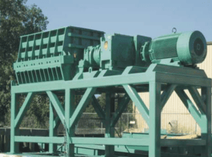 Industrial tyre grinder for recycling waste tyres and rubber materials.