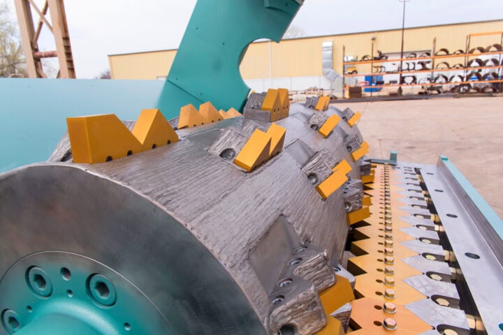 Industrial shredder machine for waste processing at Waste Initiatives.